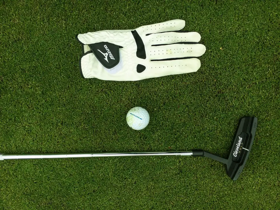 Golf Glove with Golf Ball and Putter
