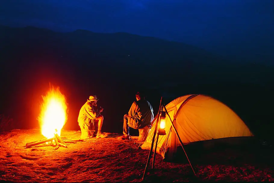Camping by the fire in a tent