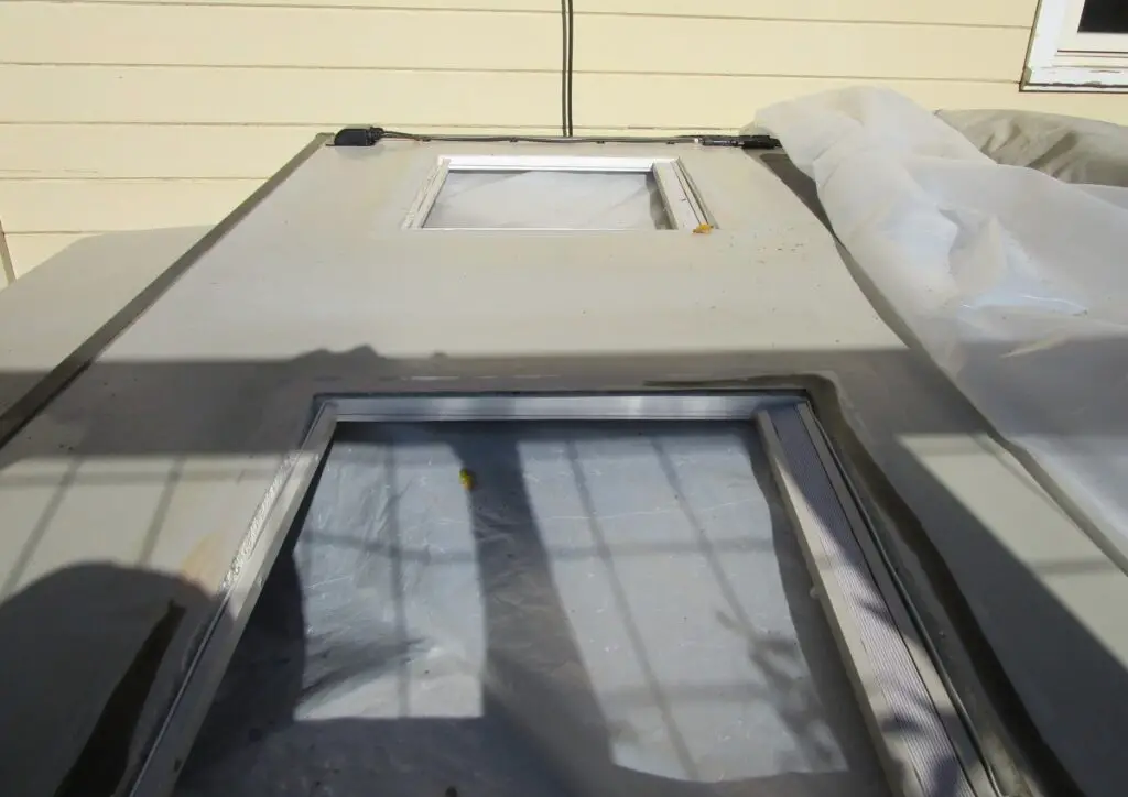 RV skylight replacement in process with the skylights removed