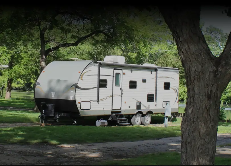 rv parked in shade