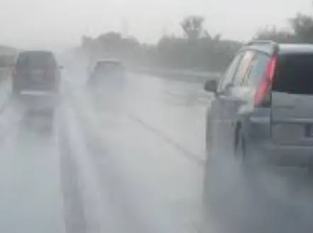 cars driving in rain
