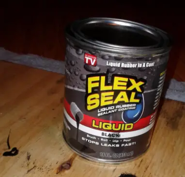 can of flex seal on wood table