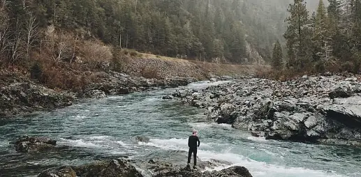 man in front of stream
