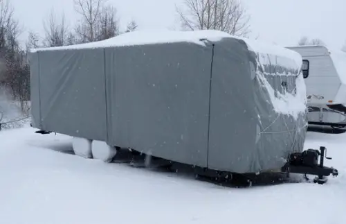rv covered in winter