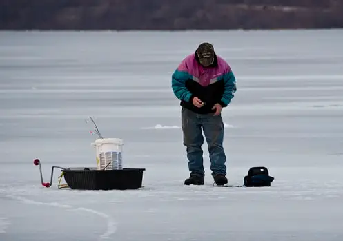 man ice fishing